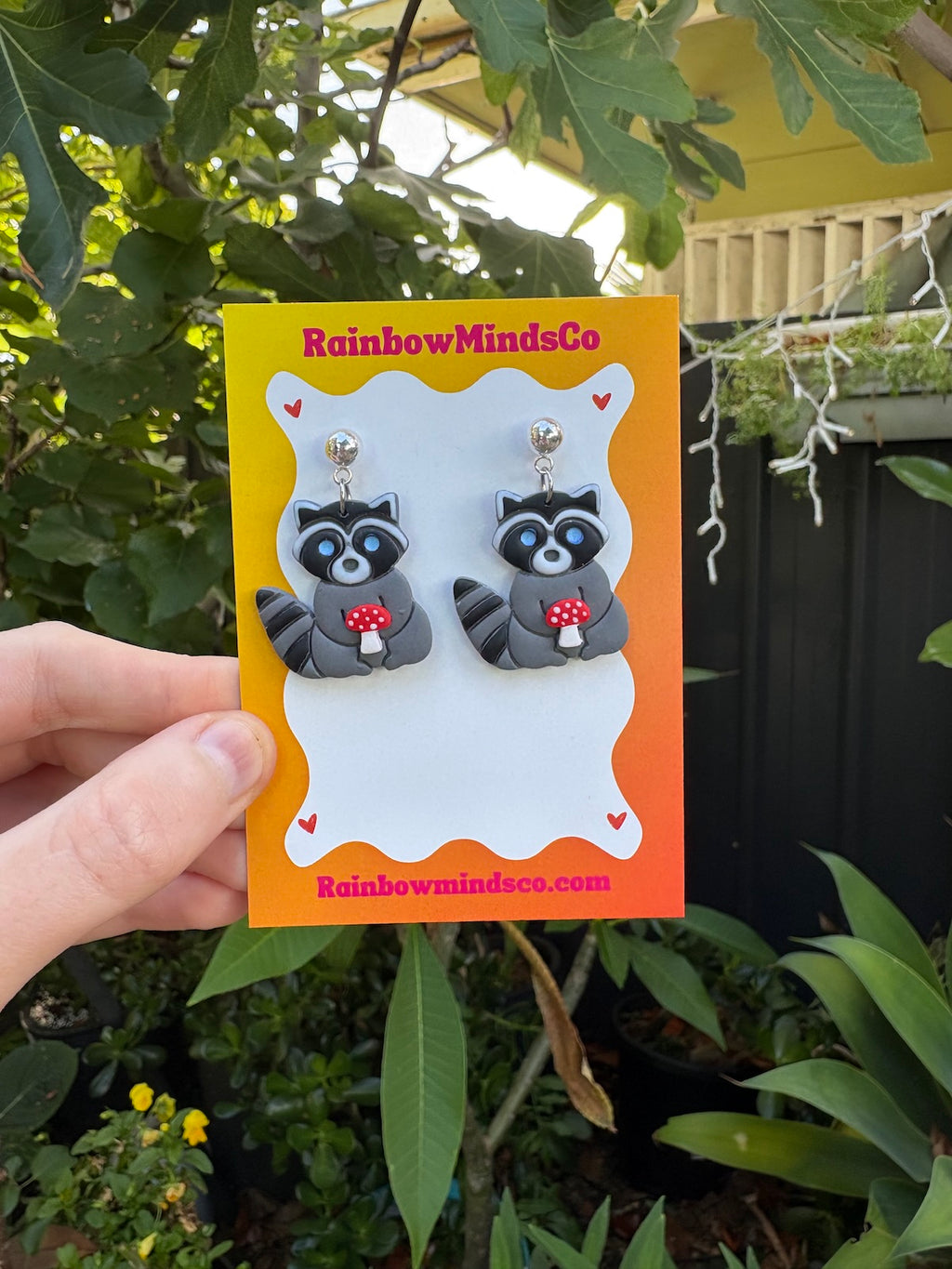 Mischief & Mushrooms Polymer Clay Earrings- Raccoon's holding mushroom dangles